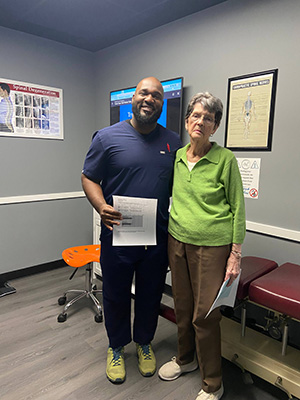 Chiropractor Warrensville Heights OH LaMar Hunter With Patient